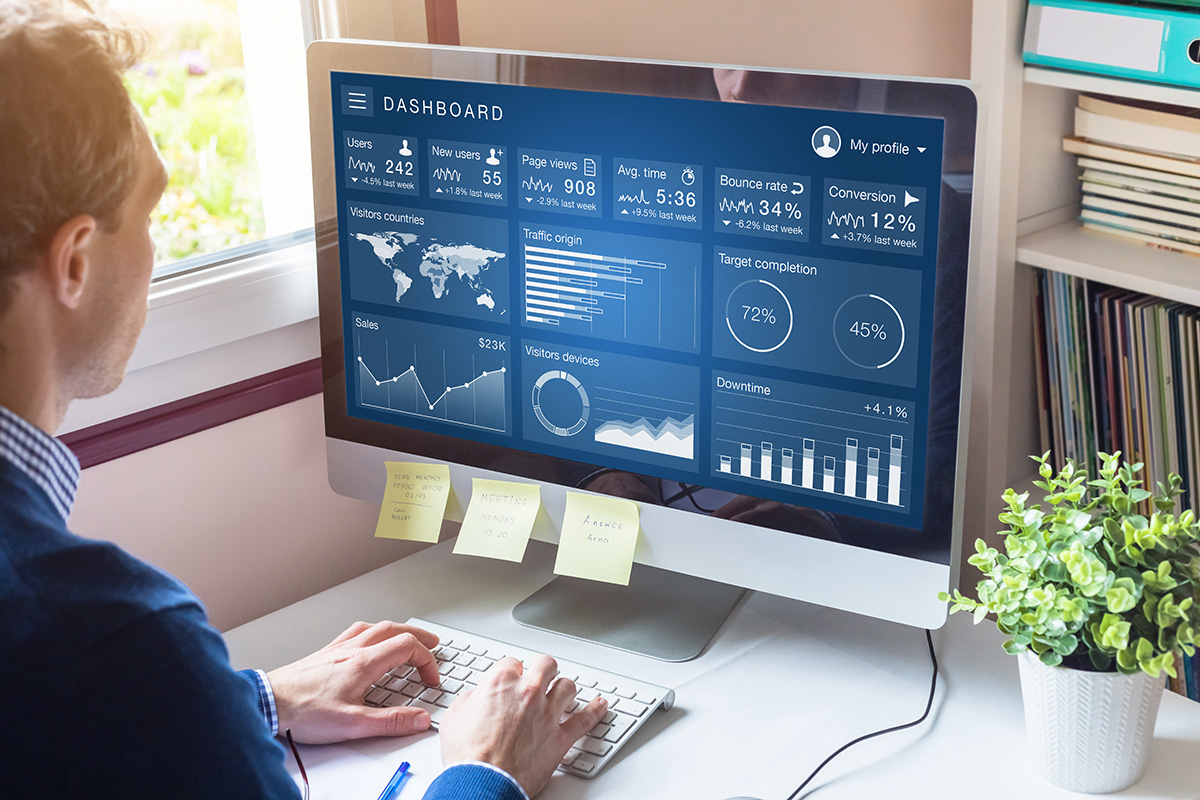 Website audit concept - working on a computer in a home office.